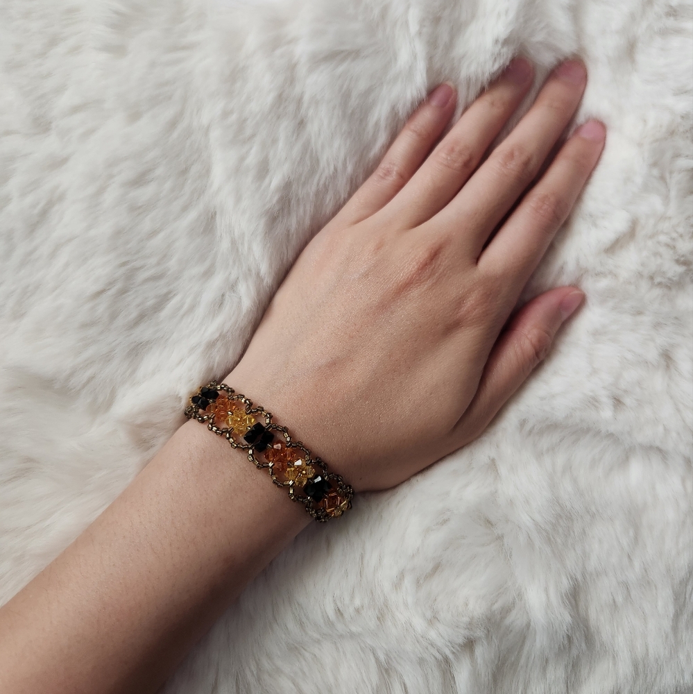 Handmade orange brown gold and black beaded bracelet ( I made it myself)